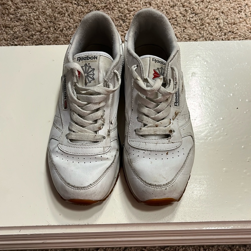Reebok white shoes.